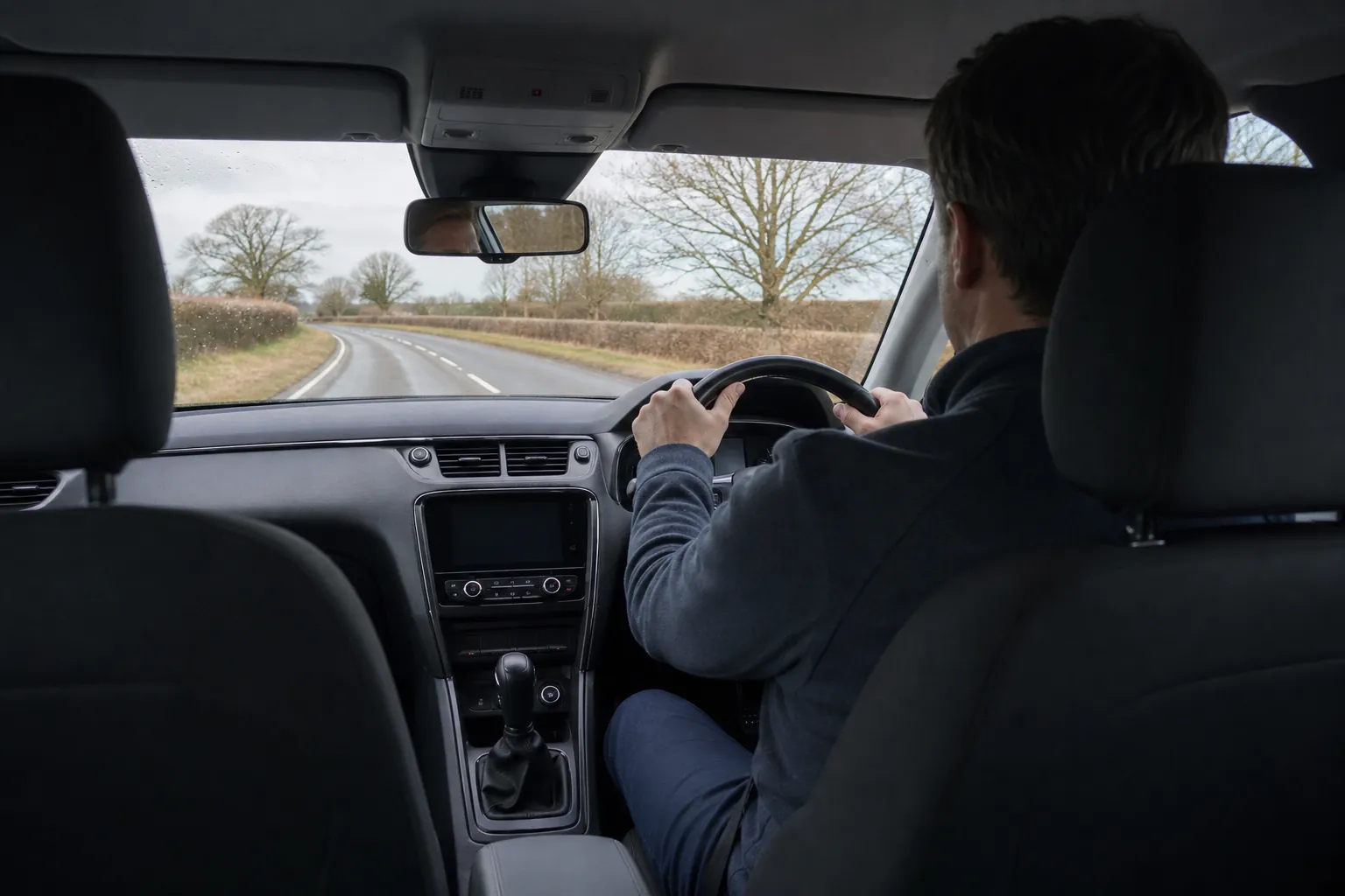A driver on a British country road